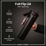 A black water bottle with a flip lid is being held; the lid is open to 240 degrees, showing its features. The bottle is displayed against a dark background. Full Flip Lid 240° Opening. QUENCH THERMAL.