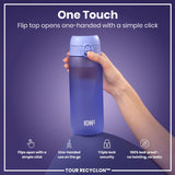A purple water bottle is being held; its flip top opens with one hand. The bottle features the brand 