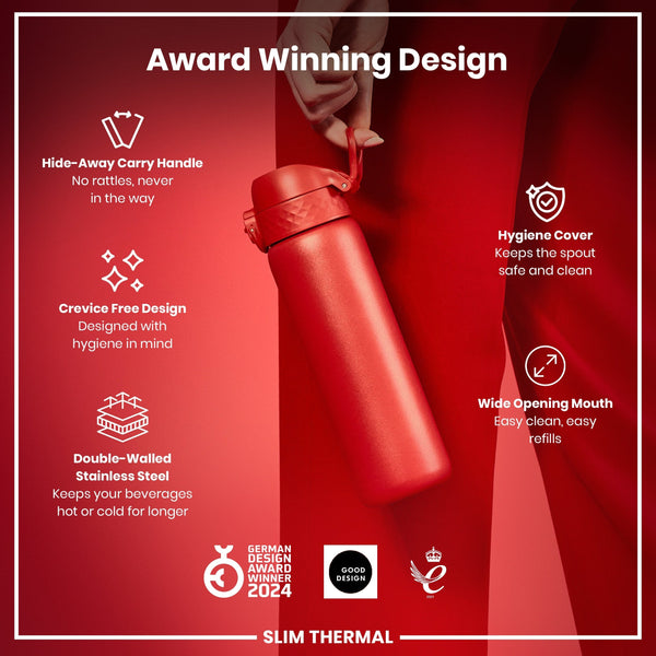 A red, double-walled stainless steel water bottle is held; it features a hide-away handle, crevice-free design, hygiene cover, and wide mouth. The bottle is advertised as award-winning and keeps beverages hot or cold longer.