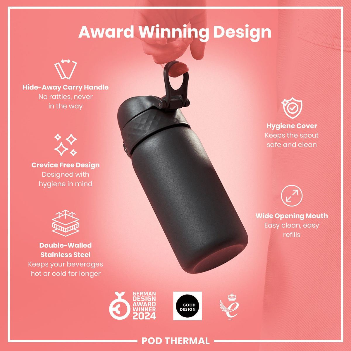 A black, double-walled stainless steel thermal bottle is being held, showcasing its features against a pink backdrop. Award Winning Design. GERMAN DESIGN AWARD WINNER 2024. GOOD DESIGN. 2021. POD THERMAL.