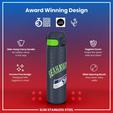 A stainless steel water bottle, featuring a Seahawks design, sits centrally. It displays a hide-away handle and a wide mouth for easy cleaning. The bottle is shown against a red and blue background, highlighting its award-winning design.