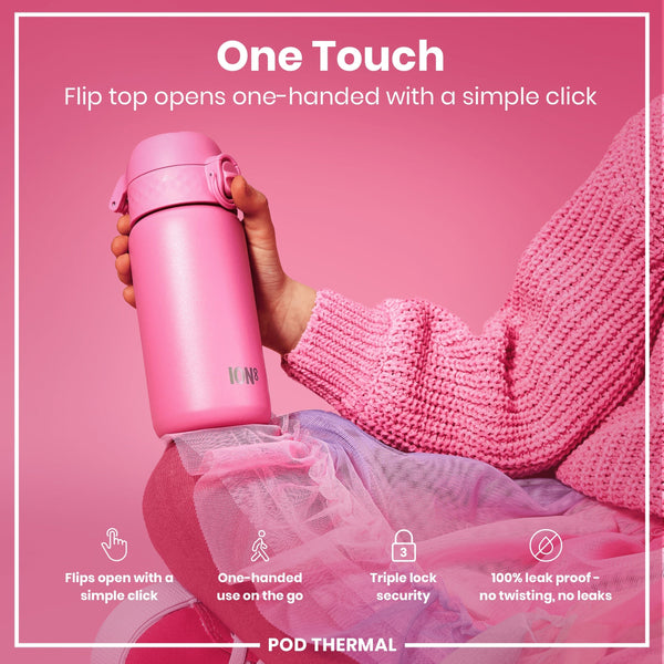 A pink ION8 water bottle is held; its flip top opens one-handed. The bottle is shown against a pink background with pink fabric. "One Touch. Flip top opens one-handed with a simple click." Also, "Flips open with a simple click," "One-handed use on the go," "Triple lock security," "100% leak proof - no twisting, no leaks," and "POD THERMAL" are present.