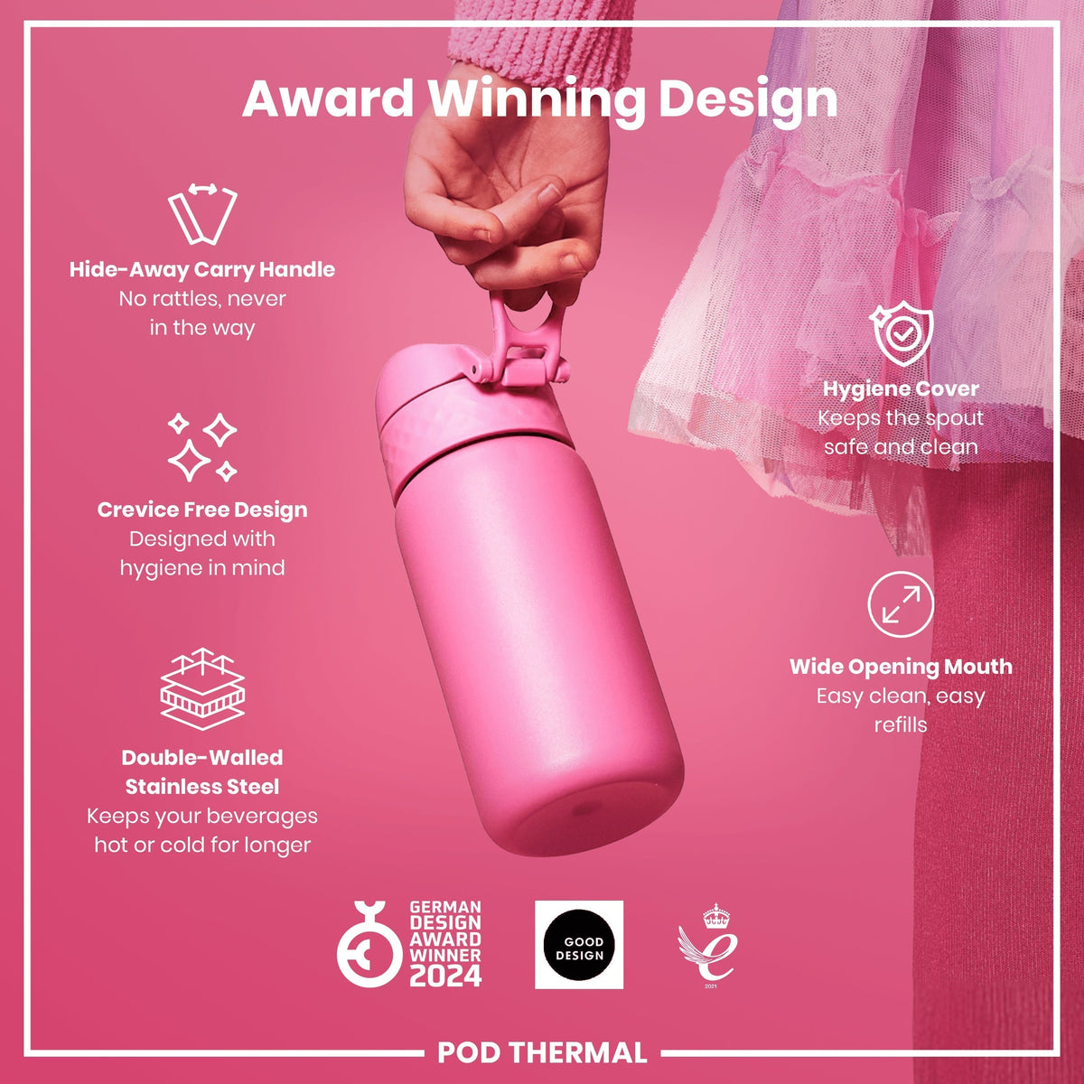A pink, double-walled stainless steel water bottle is being held; it features a hide-away handle, crevice-free design, hygiene cover, and wide mouth. Award Winning Design. German Design Award Winner 2024. Good Design.