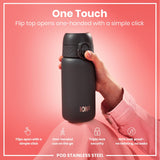 A dark gray ION8 water bottle is held; its flip top opens one-handed. The bottle rests on pink fabric; text highlights its features.