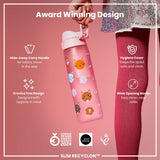 A pink water bottle, featuring a cat design, is held by a hand. Its features include a hide-away handle, crevice-free design, hygiene cover, and wide opening mouth. The bottle is an award-winning design.