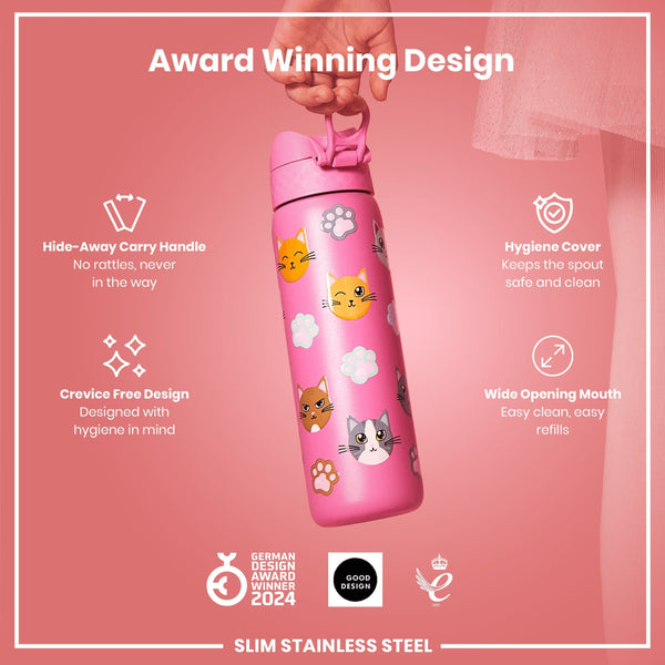 A pink, cat-patterned water bottle is being held; it features a hide-away handle, hygiene cover, and wide mouth. The bottle is made of slim stainless steel and is an award-winning design.