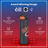 A slim stainless steel water bottle, featuring a hide-away handle and a wide opening mouth, displays an award-winning design and is shown against a red background.