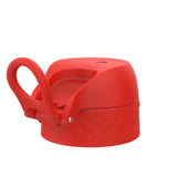 A bright red bottle cap with a looped handle resting upright features embossed text 