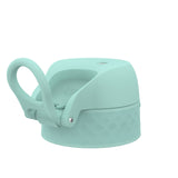 Mint green water bottle lid with a loop handle attached sits on a white background featuring a textured grip design and the word 