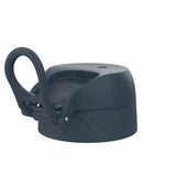 A dark-grey bottle cap, featuring a carrying loop, sits on a white background. The cap has a textured, geometric pattern and the word 